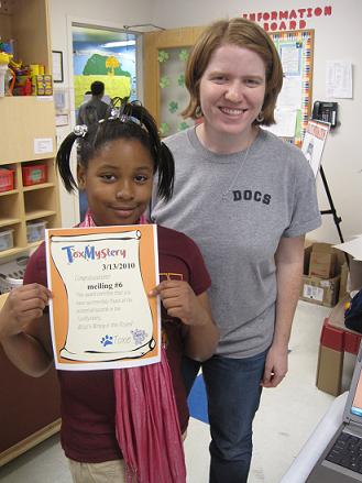 Emily and child with ToxMystery certificate